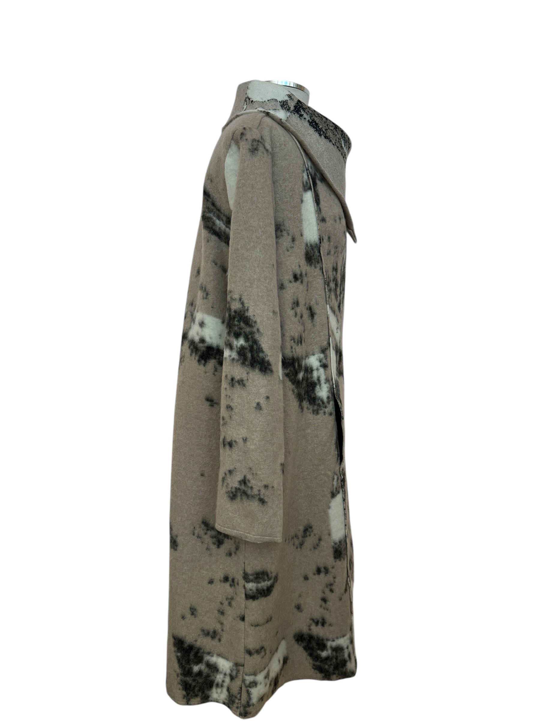 Side view of black, beige & white felted snap coat for fall