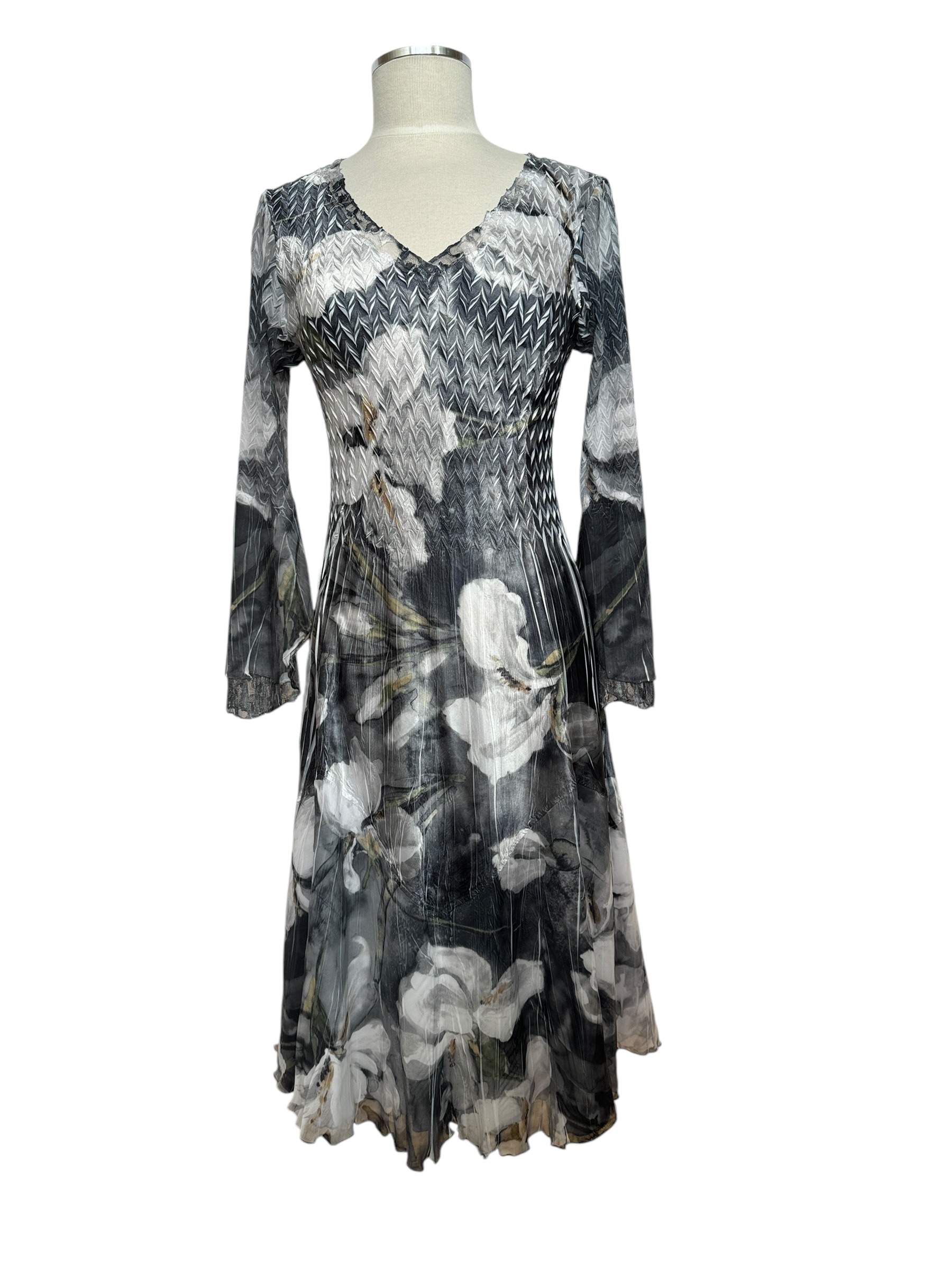 Full view of formal magnolia print, v-neck dress with bell sleeves