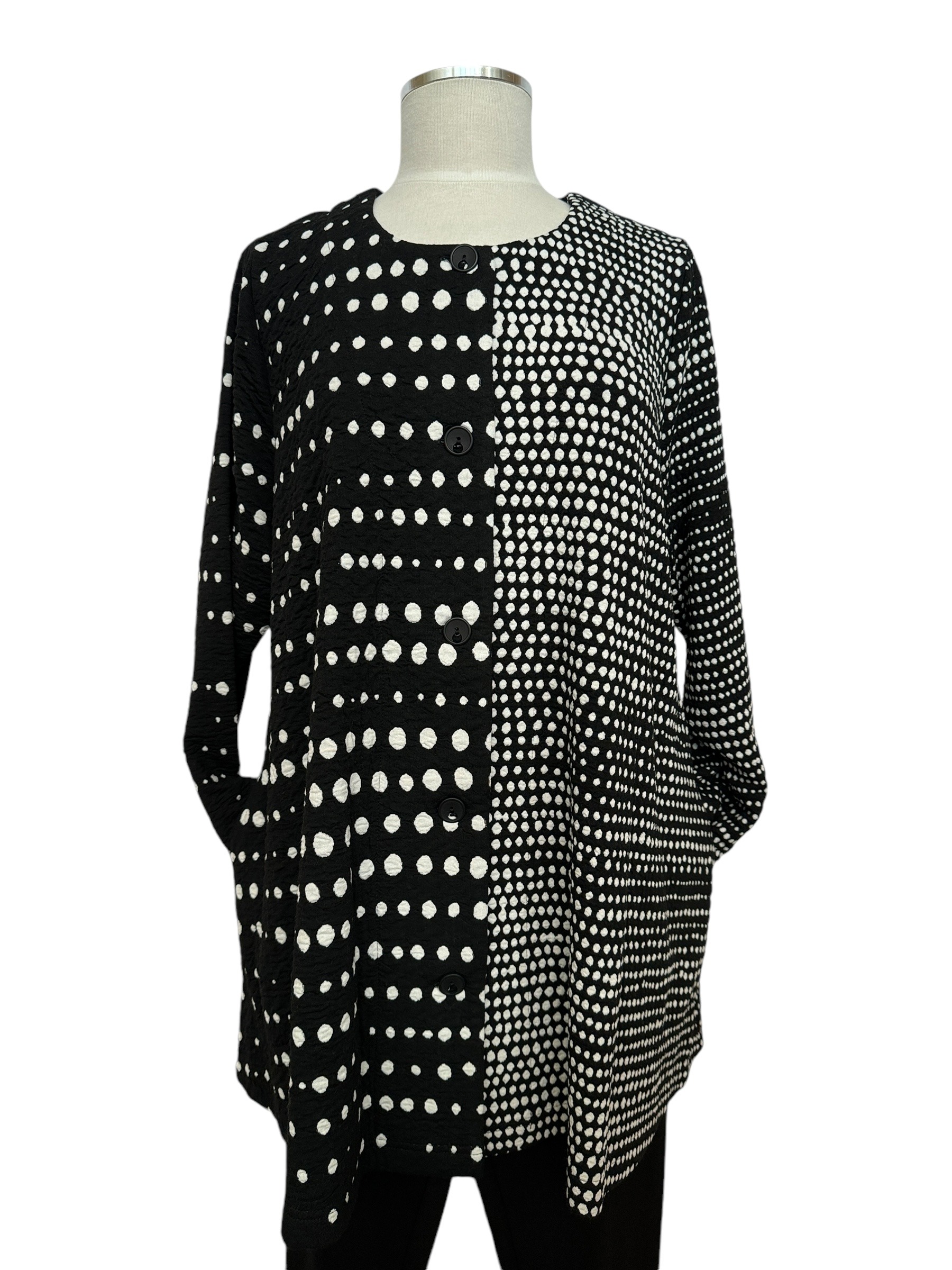 front photo of black & white polka dot knit jacket